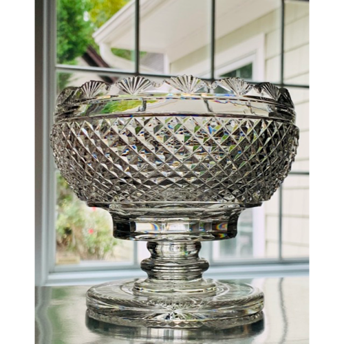 Intricately designed blue glass pedestal bowl with detailed patterns.